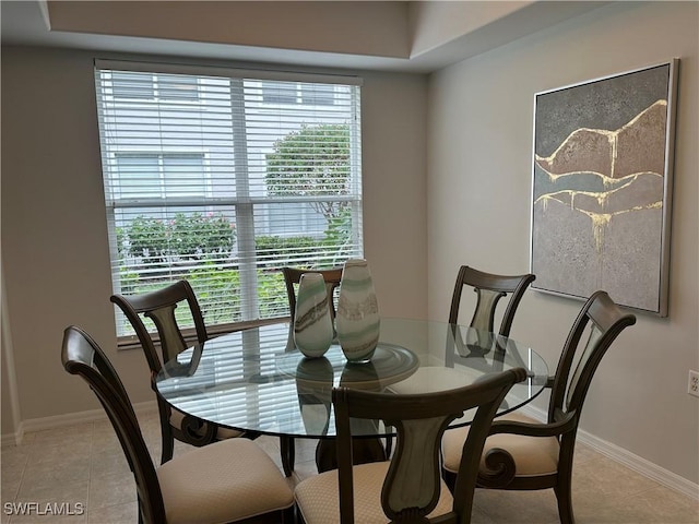 tiled dining room with plenty of natural light