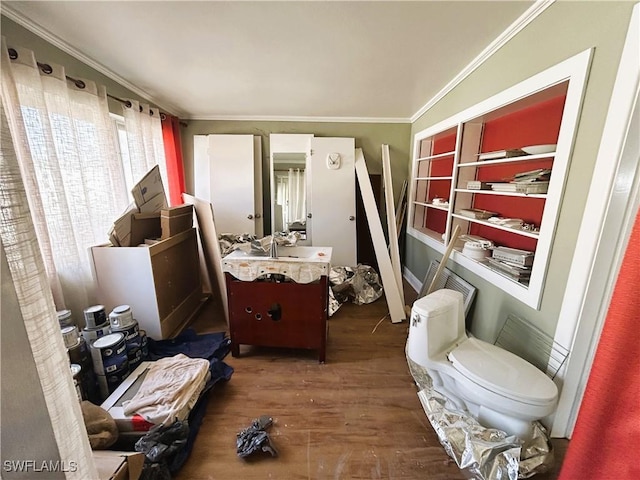 bathroom with vanity, hardwood / wood-style floors, ornamental molding, and toilet