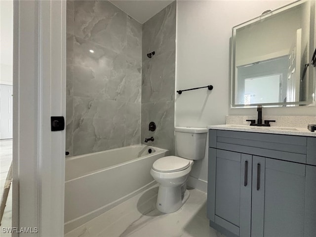 full bathroom with toilet, vanity, and tiled shower / bath