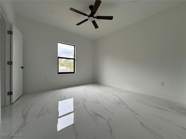 spare room featuring ceiling fan