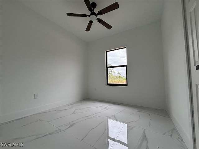 empty room with ceiling fan and lofted ceiling