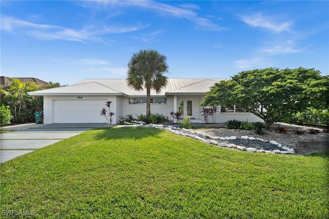 ranch-style house featuring a garage and a front lawn