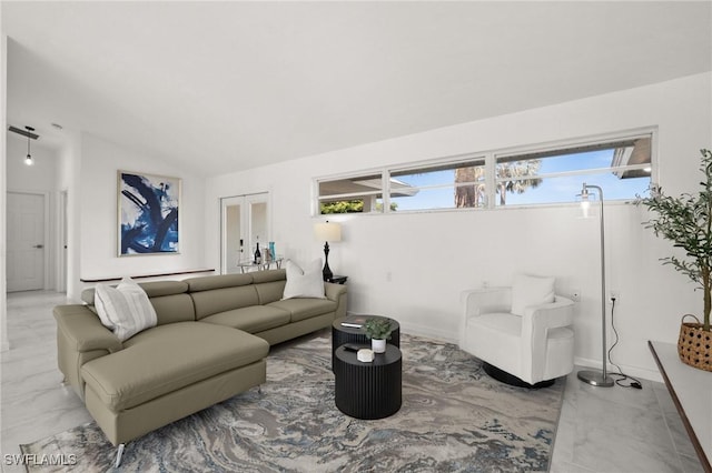 living room featuring lofted ceiling