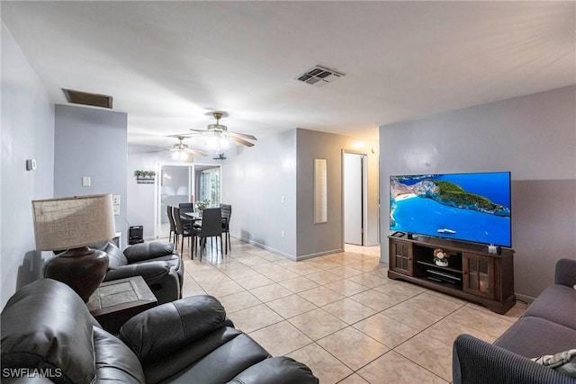 tiled living room with ceiling fan