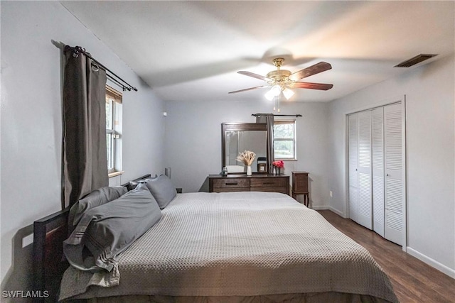 bedroom with a closet, ceiling fan, and dark hardwood / wood-style floors