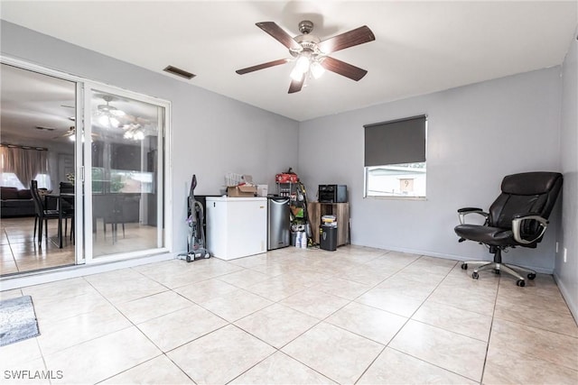 interior space with ceiling fan