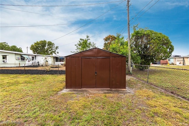 view of outbuilding with a lawn