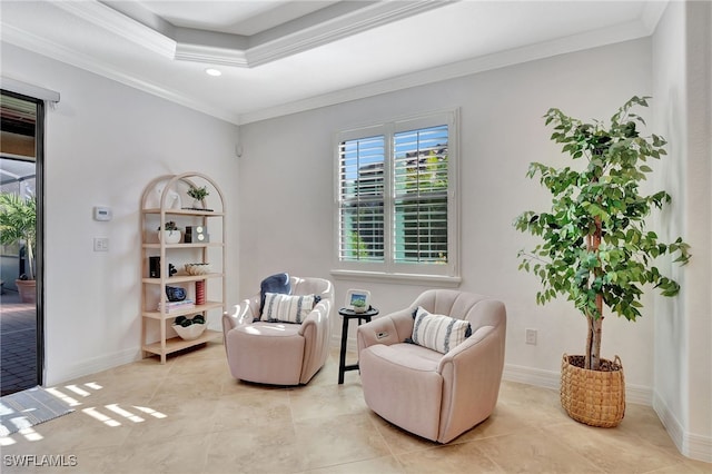 living area featuring ornamental molding, light tile patterned floors, and a tray ceiling