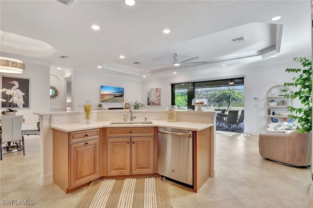 kitchen with dishwasher, sink, and a raised ceiling