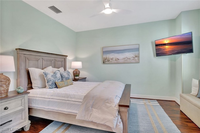 bedroom featuring dark hardwood / wood-style flooring and ceiling fan