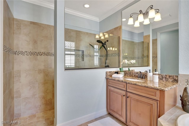 bathroom with crown molding, tiled shower, and vanity