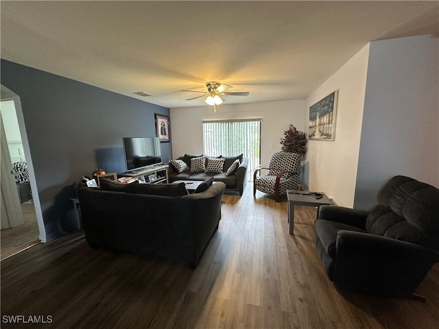 living room featuring ceiling fan and wood-type flooring