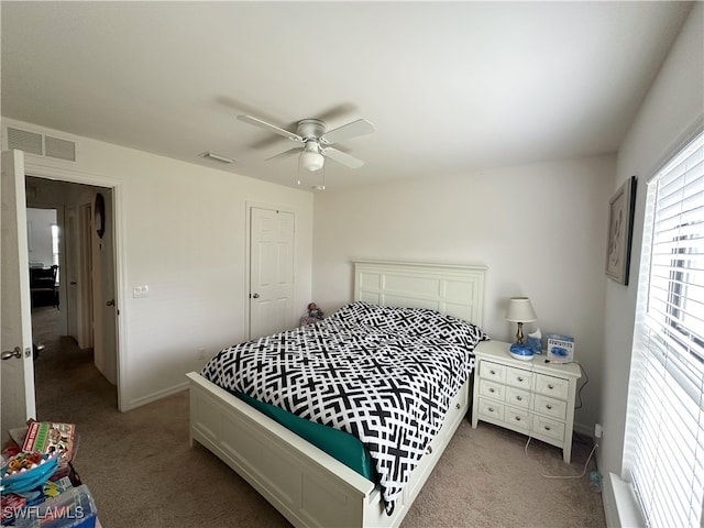 carpeted bedroom with ceiling fan