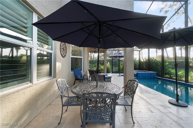 view of patio featuring a pool with hot tub