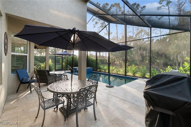 view of patio with a pool with connected hot tub, a lanai, and a grill