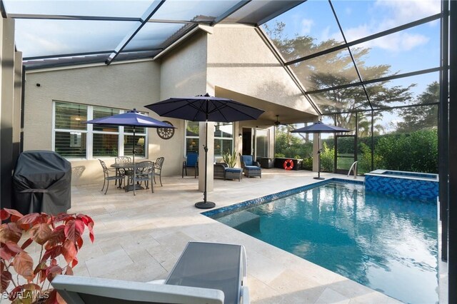 view of swimming pool with a grill, a patio area, glass enclosure, and an in ground hot tub