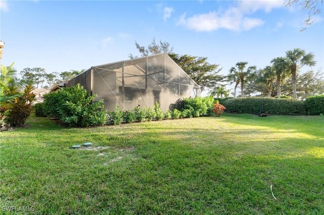 view of yard with a lanai