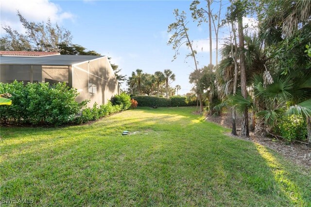 view of yard featuring a lanai