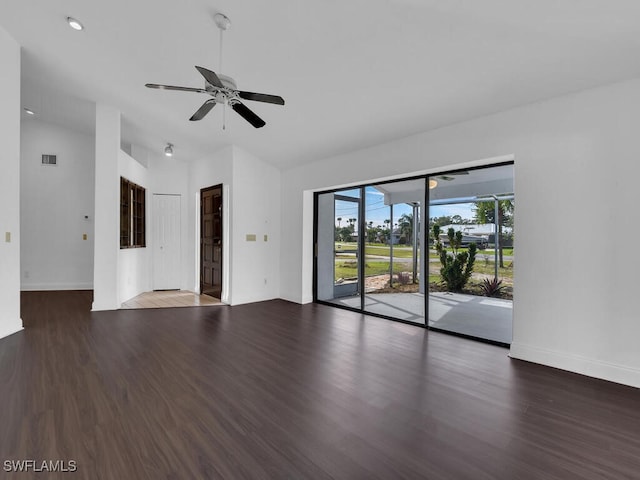 unfurnished room featuring ceiling fan and dark wood-type flooring