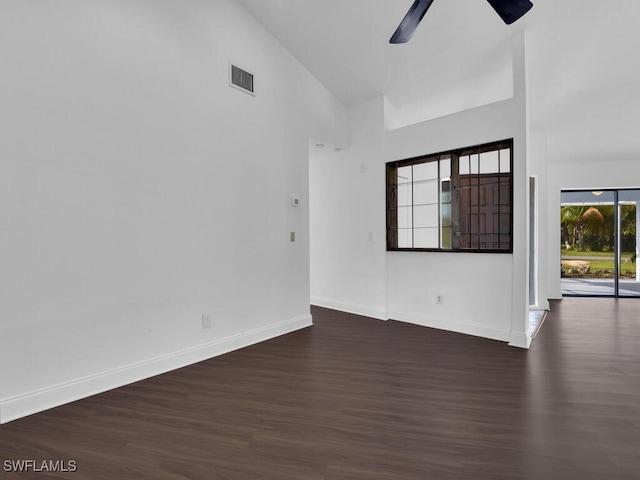 unfurnished living room featuring high vaulted ceiling, dark hardwood / wood-style flooring, and ceiling fan