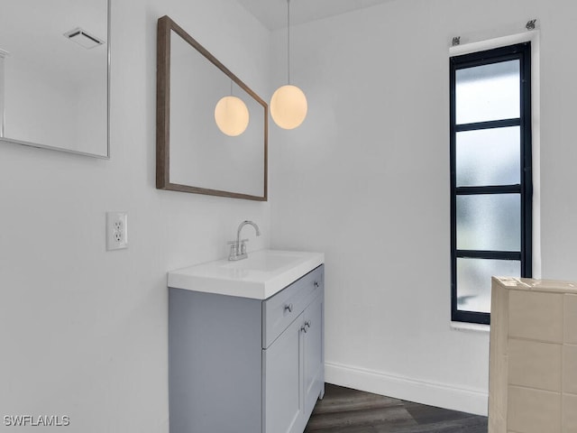 bathroom featuring vanity and hardwood / wood-style flooring