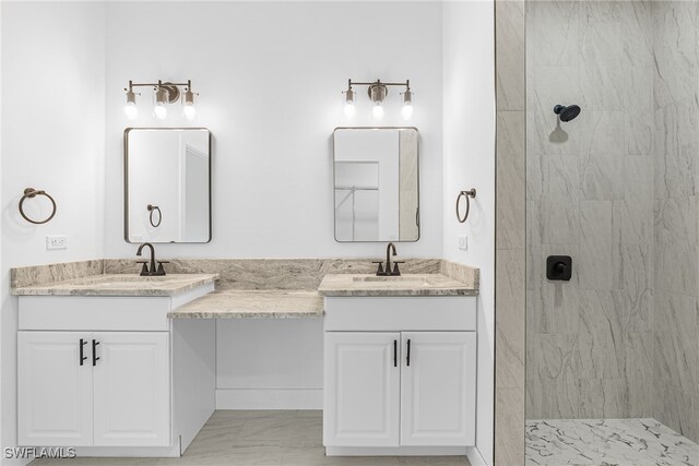 27159 Alhambra Dr, Punta Gorda, FL 33955 - bathroom with two vanities, tiled shower, and marble finish floors