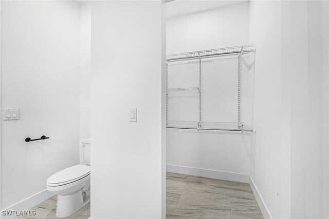 27159 Alhambra Dr, Punta Gorda, FL 33955 - bathroom with baseboards and toilet