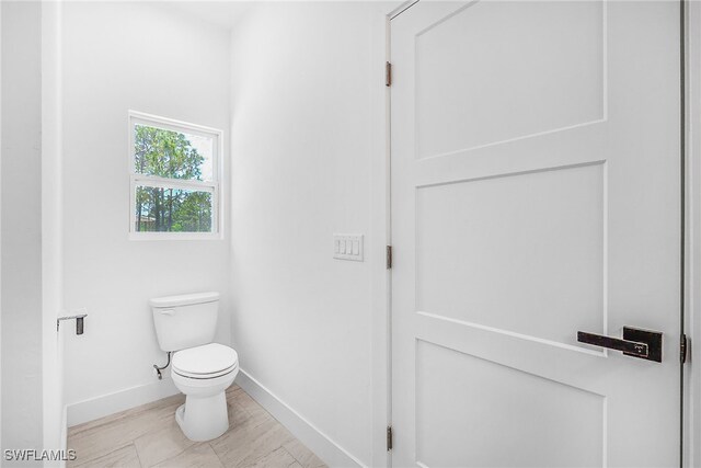 27159 Alhambra Dr, Punta Gorda, FL 33955 - bathroom featuring toilet and baseboards
