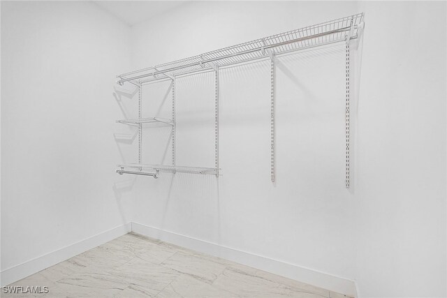 27159 Alhambra Dr, Punta Gorda, FL 33955 - walk in closet with marble look tiles
