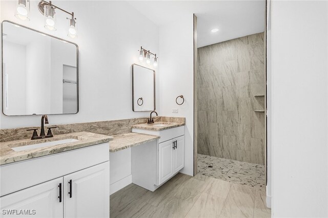 27159 Alhambra Dr, Punta Gorda, FL 33955 - full bathroom with double vanity, walk in shower, and marble look tile flooring