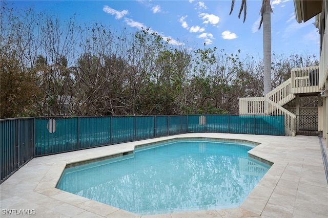 view of swimming pool with a patio area