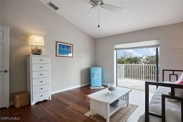 bedroom featuring ceiling fan, dark hardwood / wood-style floors, access to outside, and vaulted ceiling