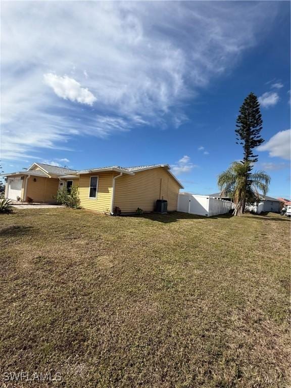 view of property exterior with a yard