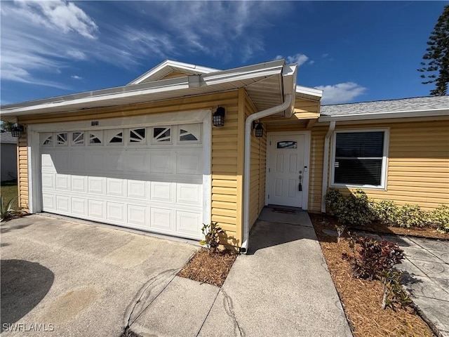 single story home featuring a garage