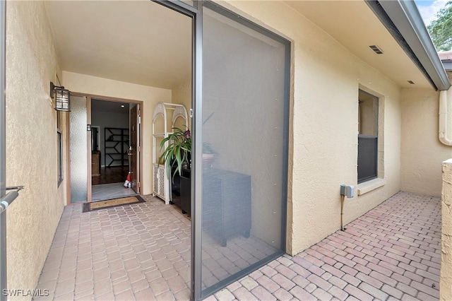 property entrance with a patio