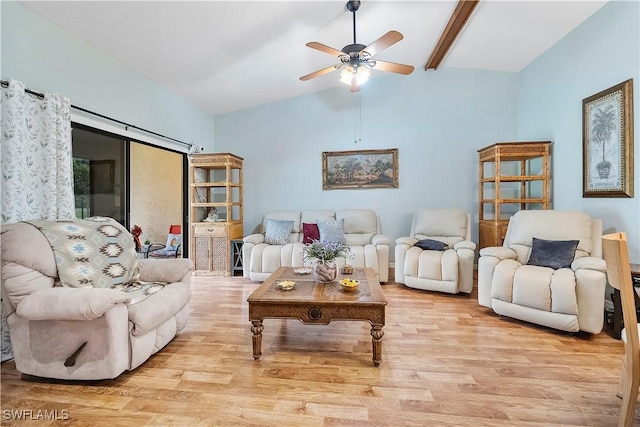 living room featuring ceiling fan, vaulted ceiling with beams, and light hardwood / wood-style flooring