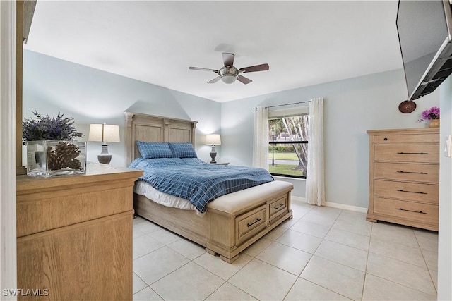 bedroom with ceiling fan and light tile patterned floors