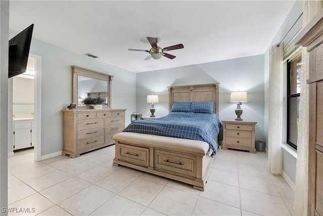 bedroom featuring ceiling fan, connected bathroom, and light tile patterned floors