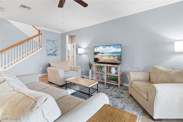 living room featuring ceiling fan and ornamental molding