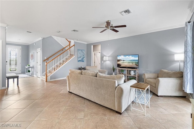 living room with ceiling fan, crown molding, and light tile patterned flooring