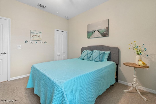 bedroom featuring a closet and carpet flooring