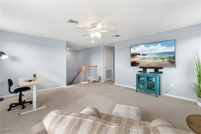 living room featuring ceiling fan and light colored carpet