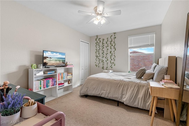 bedroom featuring ceiling fan, carpet, and a closet