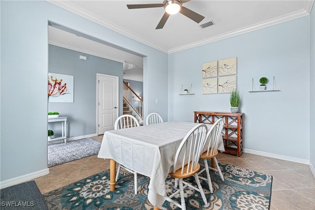 dining room featuring ceiling fan, light tile patterned floors, and ornamental molding