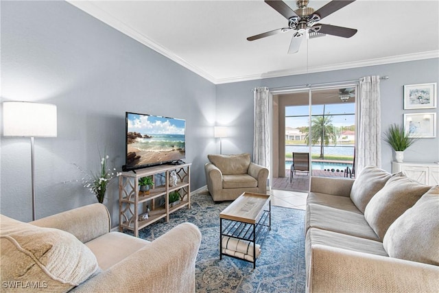 tiled living room with ceiling fan and crown molding