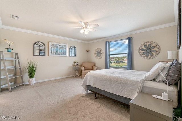 carpeted bedroom with ceiling fan and crown molding