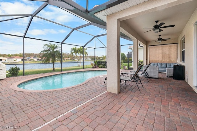 view of swimming pool featuring a patio area, a water view, ceiling fan, a lanai, and an outdoor hangout area