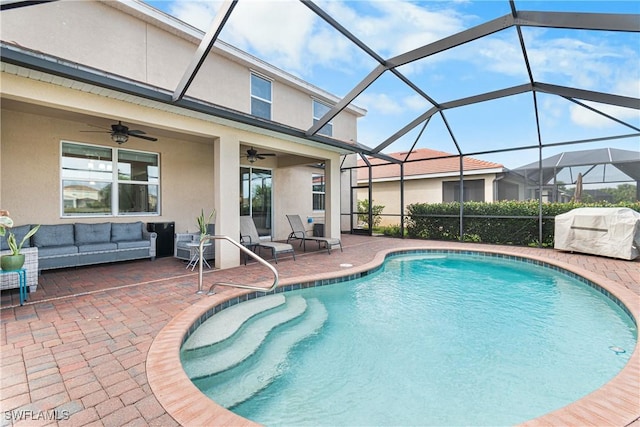 view of pool with ceiling fan, grilling area, a lanai, an outdoor hangout area, and a patio