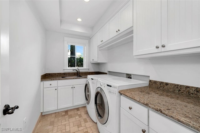 laundry room with cabinets, sink, and independent washer and dryer