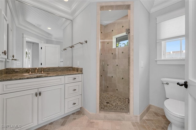 bathroom with crown molding, vanity, toilet, and a shower with door